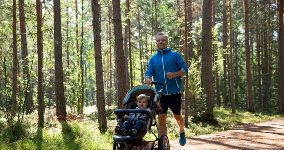 Dad running baby carriage